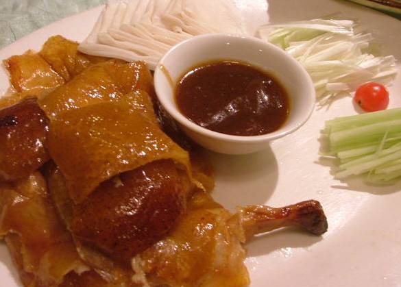 简述北京烤鸭的制作工艺流程,北京烤鸭的制作流程英语