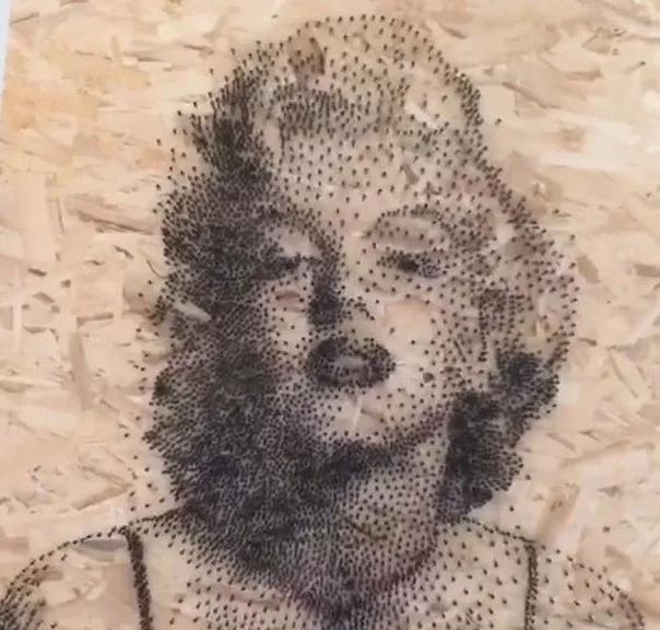 用绳子做绕线画,一根线吊起来拴着笔画画