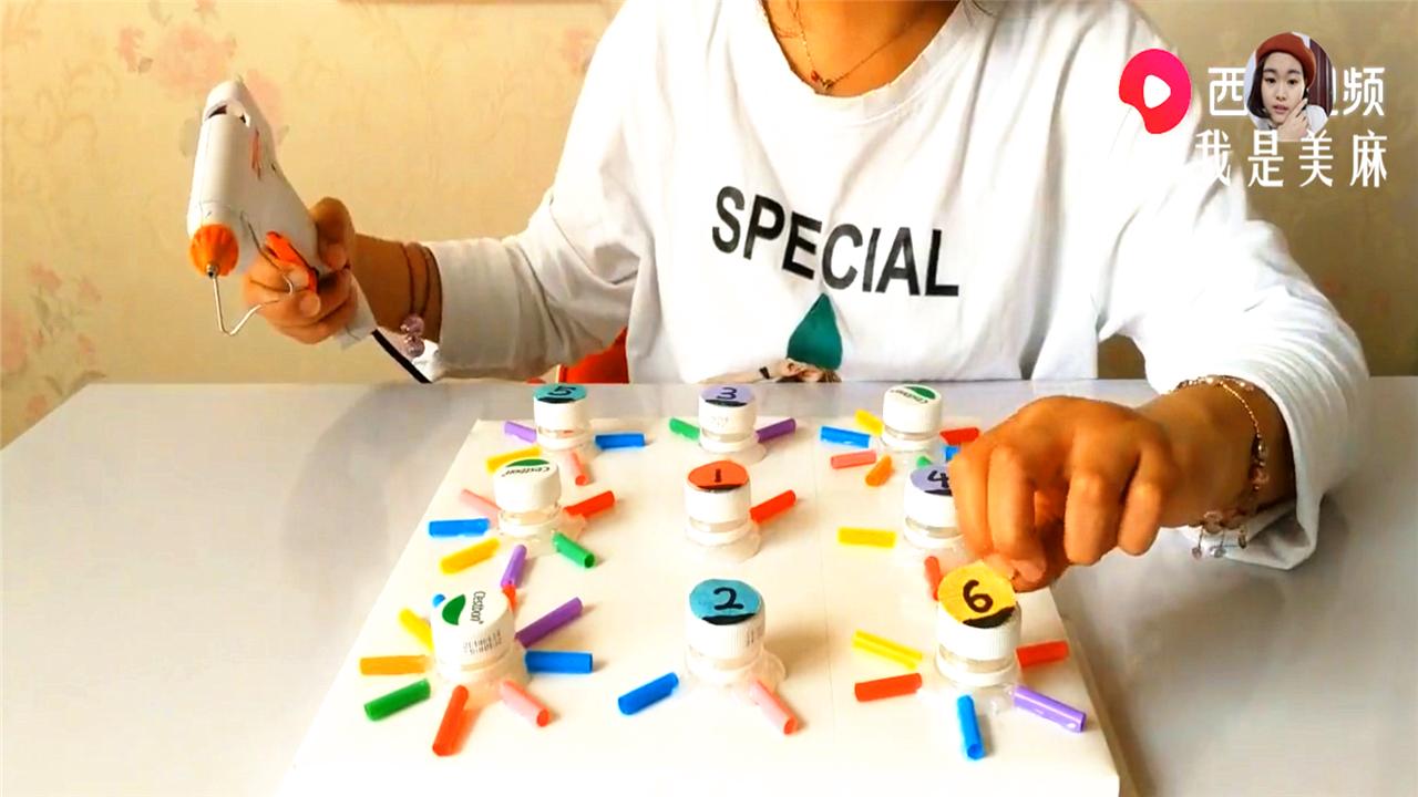 幼儿益智手工玩具制作塑料瓶,废物儿童益智玩具制作