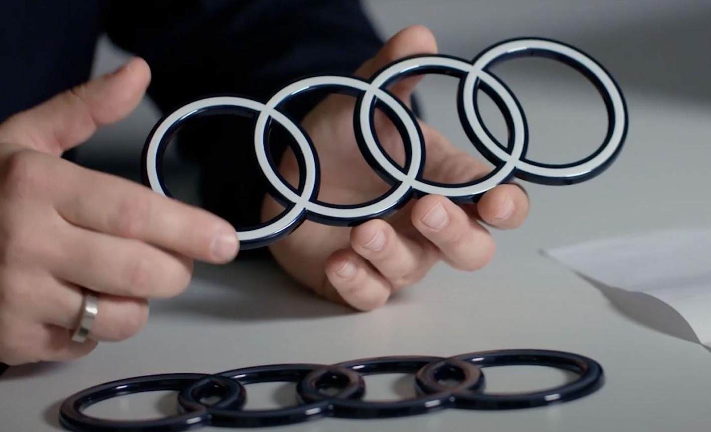 奥迪logo发光,奥迪换新标logo