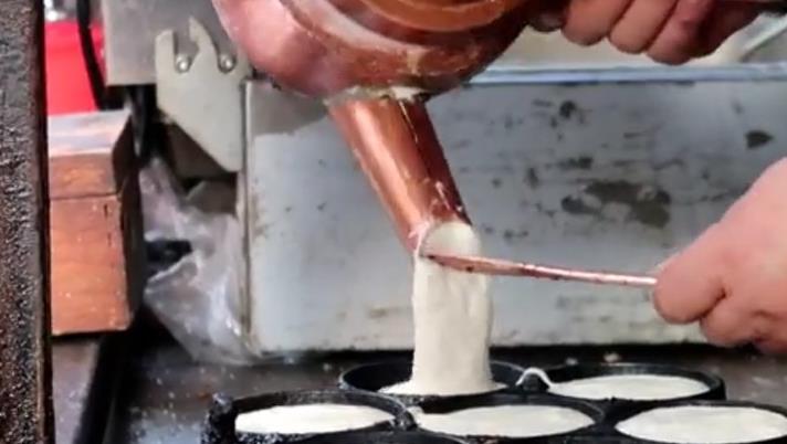 梅花糕一锅卖,梅花糕店铺