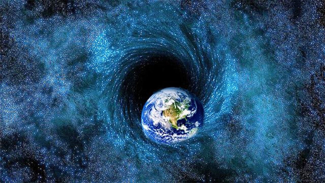 巨大的黑洞吞噬了整个太阳系,地球如果进入了黑洞会变成多大呢