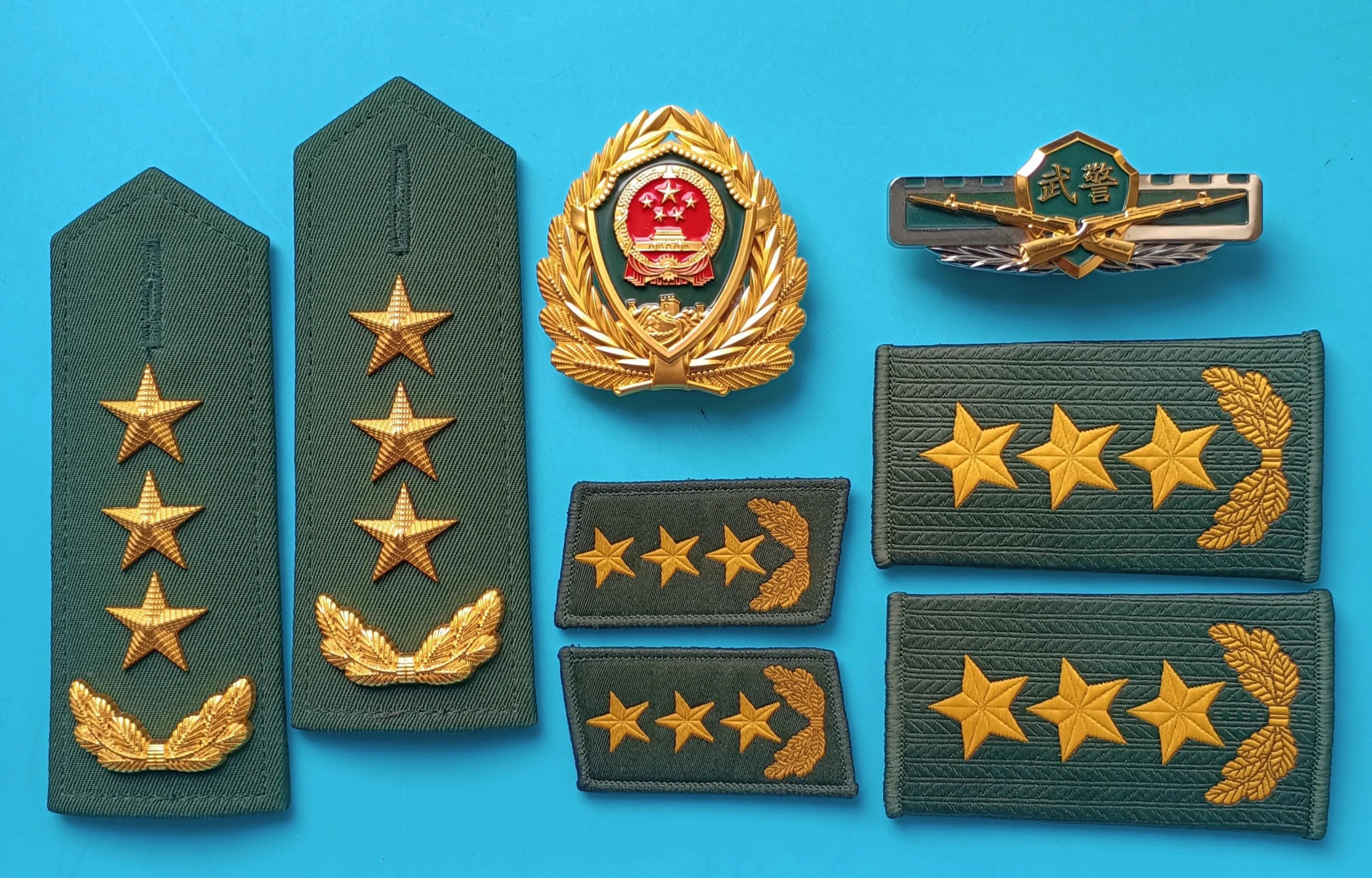 毛启国军装,毛启国警用帽徽