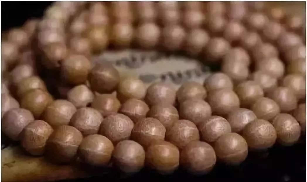 李子果核手串包浆玉化的效果,蛤蟆头核桃手串包浆玉化图片